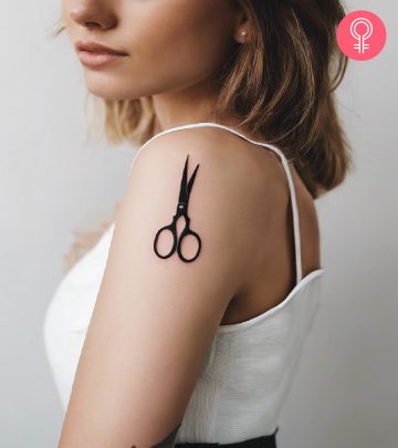 Woman with scissors tattoo on her arm Woman with scissors tattoo on her arm